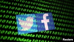 FILE PHOTO: The Twitter and Facebook logo along with binary cyber codes are seen in this illustration taken November 26, 2019. REUTERS/Dado Ruvic/Illustration/File Photo