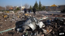 Rescue teams work after a Ukrainian plane carrying 176 passengers crashed near Imam Khomeini airport in the Iranian capital Tehran early in the morning on January 8, 2020, killing everyone on board. (Photo by AFP)