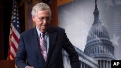FILE - Senate Majority Leader Mitch McConnell, R-Ky., finishes speaking to reporters at the Capitol in Washington, Oct. 6, 2018. 