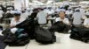 FILE - North Korean workers assemble Western-style suits at the South Korean-run ShinWon Corp. garment factory inside the Kaesong Industrial Complex in Kaesong, North Korea.