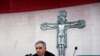 FILE - Cardinal Giovanni Angelo Becciu, caught up in a real estate scandal, speaks to the media a day after he resigned, in Rome, Italy, Sept. 25, 2020. A trial is now underway at the Vatican involving Becciu and nine other defendants. 