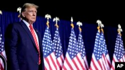 El aspirante presidencial republicano, el expresidente Donald Trump, habla en un mitin de campaña el sábado 9 de marzo de 2024 en Rome, en el estado de Georgia, EEUU. 
