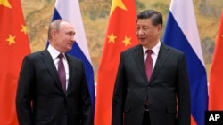 资料照：中国领导人习近平与俄罗斯总统普京在北京会面。（2022年2月4日）