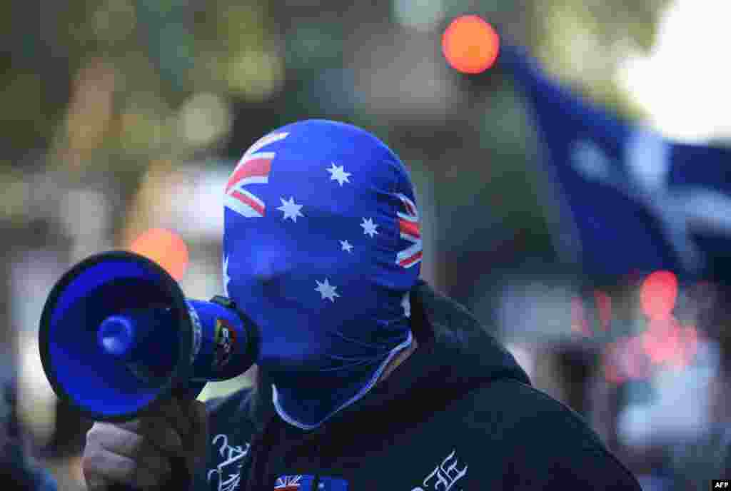 An anti-Muslim protester shouts slogans outside the Parramatta Mosque in Sydney, Australia. A small number of protesters gathered outside the mosque, which was regularly attended by 15-year-old radicalized Farhad Jabar, who killed a police worker a week ago before dying in a gunbattle with police.