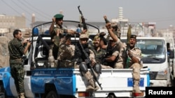 Houthi troops ride on the back of a police patrol truck after participating in a Houthi gathering in Sanaa, Yemen February 19, 2020. REUTERS/Khaled Abdullah