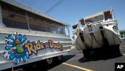 FILE - Duck boats sit idle in the parking lot of Ride the Ducks in Branson, Mo., July 21, 2018.