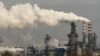FILE - In this Nov. 28, 2019, file photo, smoke and steam rise from a coal processing plant in Hejin in central China's Shanxi Province. 