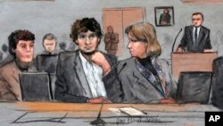 FILE - In this March 5, 2015 courtroom sketch, Dzhokhar Tsarnaev, center, is depicted between defense attorneys Miriam Conrad, left, and Judy Clarke, right, during his federal death penalty trial in Boston. 