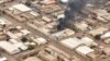 A view shows a fire at the industrial area given as Omdurman, Sudan, April 30, 2023, in this still image taken from video obtained by Reuters. 
