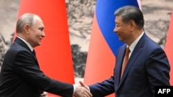Ruski predsednik Vladimir Putin i kineski predsednik Ši Đinping u Pekingu 16. maja 2024.
(Sergei GUNEYEV/Sputink / POOL / AFP) 