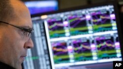 Anthony Matesic, a designated market maker, follows stock prices at the New York Stock Exchange, Dec. 10, 2018.