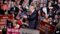 FILE - President Donald Trump speaks at a rally in Nashville, Tenn. Trump is taking his message directly to his ardent supporters.