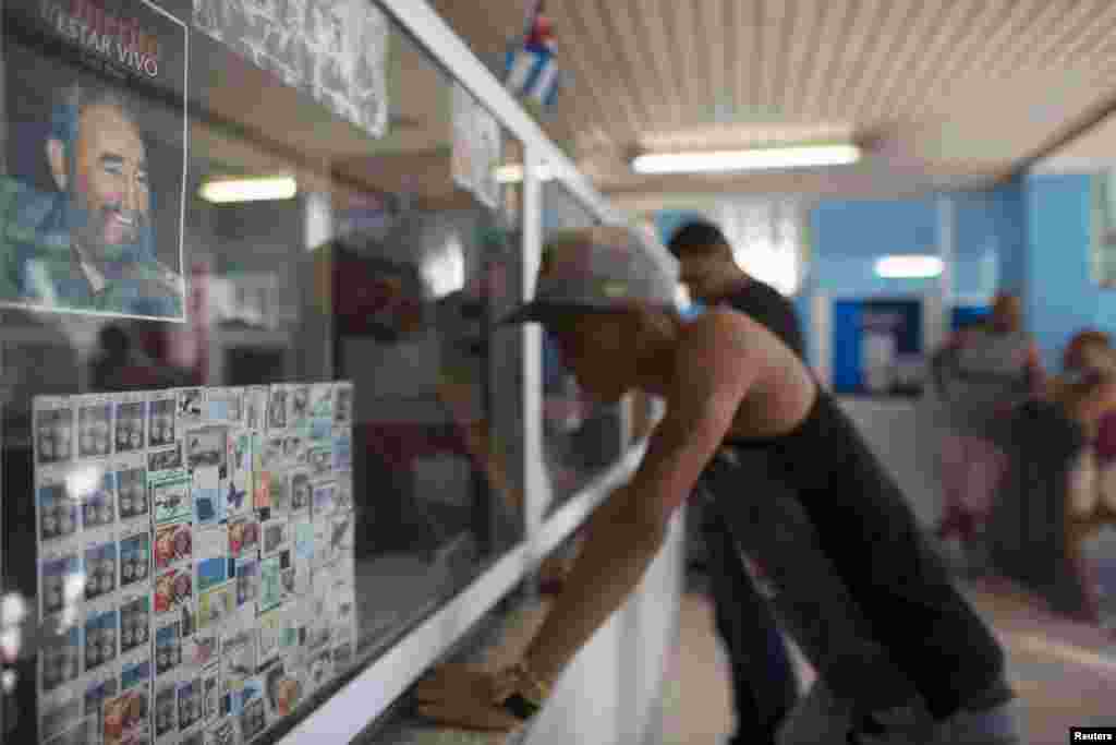 A picture of former Cuban President Fidel Castro is seen inside a post office in Havana, Dec. 11, 2015.