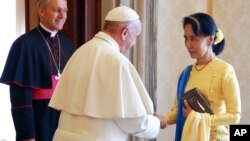 State Counsellor and Union Minister for Foreign Affairs of the Republic of the Union of Myanmar Aung San Suu Kyi (right) is welcomed by Pope Francis on the occasion of their private audience, at the Vatican, May 4, 2017.