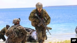 日本與美軍關島軍演資料照。