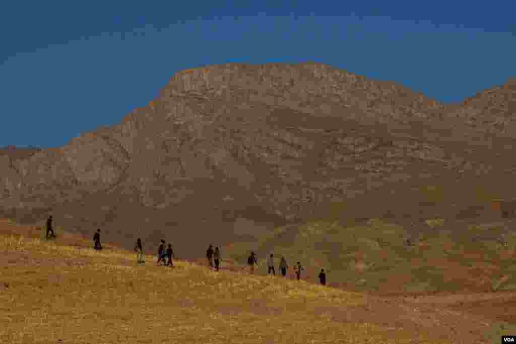 Refugees from Afghanistan can be seen in the hills and fields of eastern Turkey, Sept. 1, 2021.
