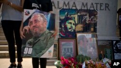 People with images of Fidel Castro gather one day after his death in Havana, Cuba, Nov. 26, 2016. Cuba will observe nine days of mourning for the former president who ruled Cuba for half a century.
