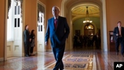 FILE - Senate Majority Leader Mitch McConnell of Ky. walks to his office on Capitol Hill in Washington.