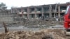 Petugas keamanan Afghanistan memeriksa lokasi serangan di pangkalan angkatan darat di Gardez, ibu kota provinsi Paktia, Afghanistan, 14 Mei 2020. 