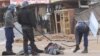 FILE: Armed Zimbabwean police beat up alleged rioters in Harare, Monday, July, 6, 2016. (AP Photo/Tsvangirayi Mukwazhi)