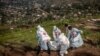 Members of the Congolese Red Cross carry body bags containing human remains during a mass burial for victims of the clashes in eastern Democratic Republic of Congo, at Musigiko cemetery in Bukavu on Feb. 20, 2025.
