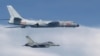This photo taken July 22, 2017, by Taiwan's Defense Ministry shows a Taiwanese jet intercepting a Chinese H-6 bomber over the East China Sea.