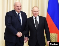 FILE PHOTO: Russian President Vladimir Putin meets with Belarusian President Alexander Lukashenko outside Moscow