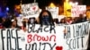 Protesters march in the streets during another night of protests over the police shooting of Keith Lamont Scott in Charlotte, North Carolina, Sept. 23, 2016.