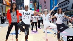 Pfizer's Get Old Initiative. Tao Porchon-Lynch teaches yoga to hundreds in Times Square, NYC. (Brian Ach/AP Images forPfizer)
