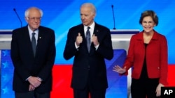 De la gauche vers la droite, Bernie Sanders, Joe Biden, et Elisabeth Warren, trois candidats à l'investiture démocrate qui devront désormais compter avec l'ancien maire de New York, Michael Bloomberg.