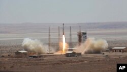 This photo, released by the official website of the Iranian Defense Ministry, July 27, 2017, claims to show the launching of Simorgh satellite-carrying rocket in an undisclosed location in Iran.