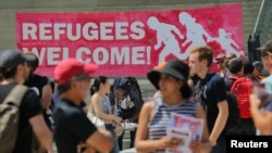  People gather for an anti-racism rally in downtown Toronto, Aug. 11, 2018. Canada announced Wednesday plans to increase deportations of immigrants in the country illegally.