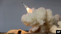 FILE - In this Dec. 29, 2016, file photo, released by the semiofficial Iranian Students News Agency (ISNA), a long-range S-200 missile is fired in a military drill in the port city of Bushehr, on the northern coast of Persian Gulf, Iran.