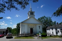 Members of 164-year-old Waldoboro United Methodist Church chat following a service, Sunday, June 20, 2021, in Waldoboro, Maine. (AP Photo/Robert F. Bukaty)