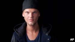 Swedish DJ, remixer and record producer Avicii poses for a portrait, Aug. 30, 2013, in New York.