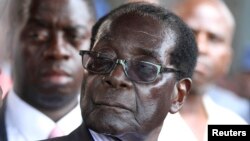 FILE: Zimbabwe President Robert Mugabe addresses supporters outside ZANU-PF headquarters, Harare, Oct. 30, 2014.