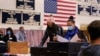 Women cast their ballots at a polling station in Windham, New Hampshire, Nov. 3, 2020. 