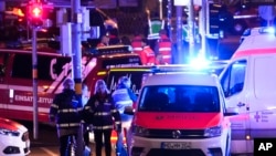 Emergency services work in a cordoned-off area near a Christmas Market, after an incident in Magdeburg, Germany, Dec. 20, 2024. 