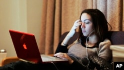 Gabriela Gonzalez, a freshman at Northwestern University, in her dorm on Dec. 9, 2007, in Evanston, Ill. 