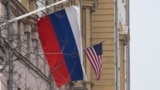 A Russian flag flies next to a U.S. flag at the U.S. Embassy in Moscow on March 13, 2025. U.S. special envoy Steve Witkoff arrived in Moscow Thursday to meet with Russian officials about a Ukraine-Russia ceasefire proposal.