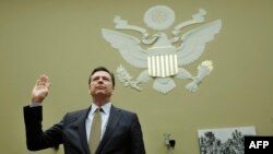 FILE - FBI Director James Comey is swornin before a House Oversight and Government Reform Committee hearing on Capitol Hill in Washington, D.C., July 7, 2016. Comey is scheduled to testify Thursday at a highly anticipated hearing on possible connections between President Donald Trump's campaign and Russia.