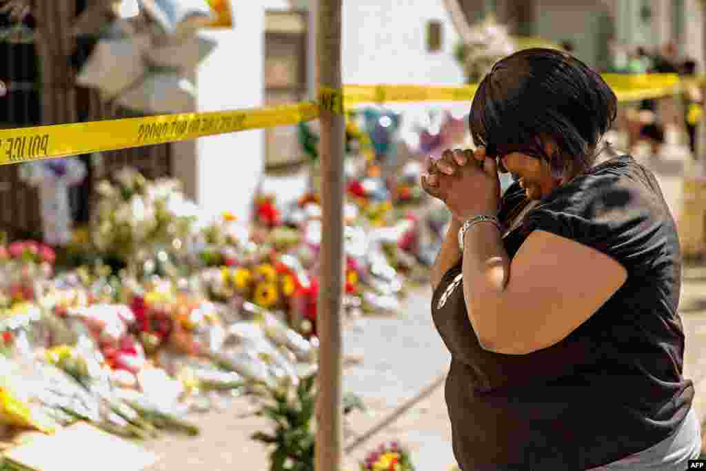 A woman weeps outside the historic Emanuel African Methodist Episcopal Church, Charleston, South Carolina, June 19, 2015.