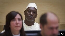 Thomas Lubanga (au c.), attendant son verdict à La Haye (14 mars 2012) 