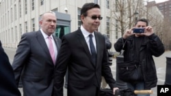 Former Honduran President Rafael Callejas, center, and his attorney Manuel Retureta, leave federal court in New York, March 28, 2016. 