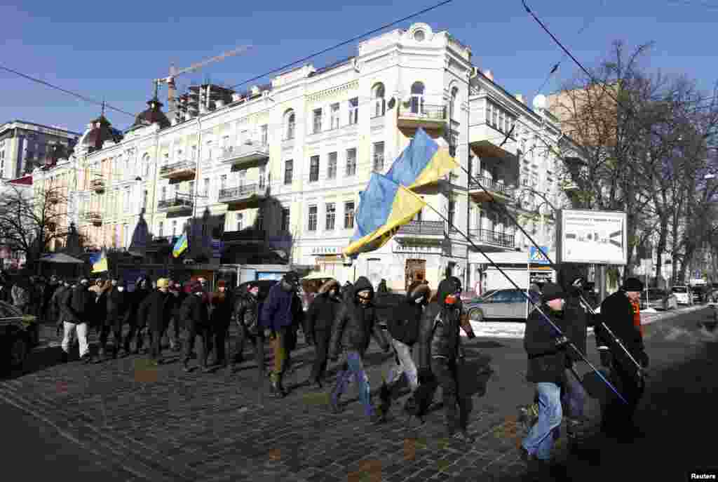 Anti-government protesters march in central Kyiv, Jan. 31, 2014.