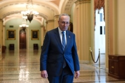 FILE - Senate Minority Leader Sen. Chuck Schumer of N.Y., walks on Capitol Hill in Washington, Friday, Jan. 3, 2020. (AP Photo/Susan Walsh)