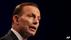 FILE - Australian Prime Minister Tony Abbott, pictured at a G-20 summit in Brisbane in November, says his recent mention of disaster aid to Indonesia was a reference to the two nations' strong friendship.