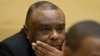 FILE - Former Congo vice-president Jean-Pierre Bemba looks up at his trial at the International Criminal Court in The Hague, Netherlands, Sept. 29, 2015.