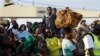 In this image taken Saturday May 23, 2015, refugees who fled Burundi's violence and political tension arrive in Kigoma, Tanzania, rafter making the journey on Lake Tanganyika. aT LEAST 144,000 have fled Burundi because they are afraid of getting caught in