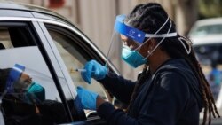 A nurse administers a dose of the Moderna COVID-19 vaccine during the outbreak of the coronavirus disease (COVID-19), in Pasadena